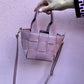 Borsa in vera pelle a secchiello con intreccio