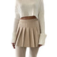 Minigonna stile collegiale beige con balze