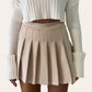 Minigonna stile collegiale beige con balze